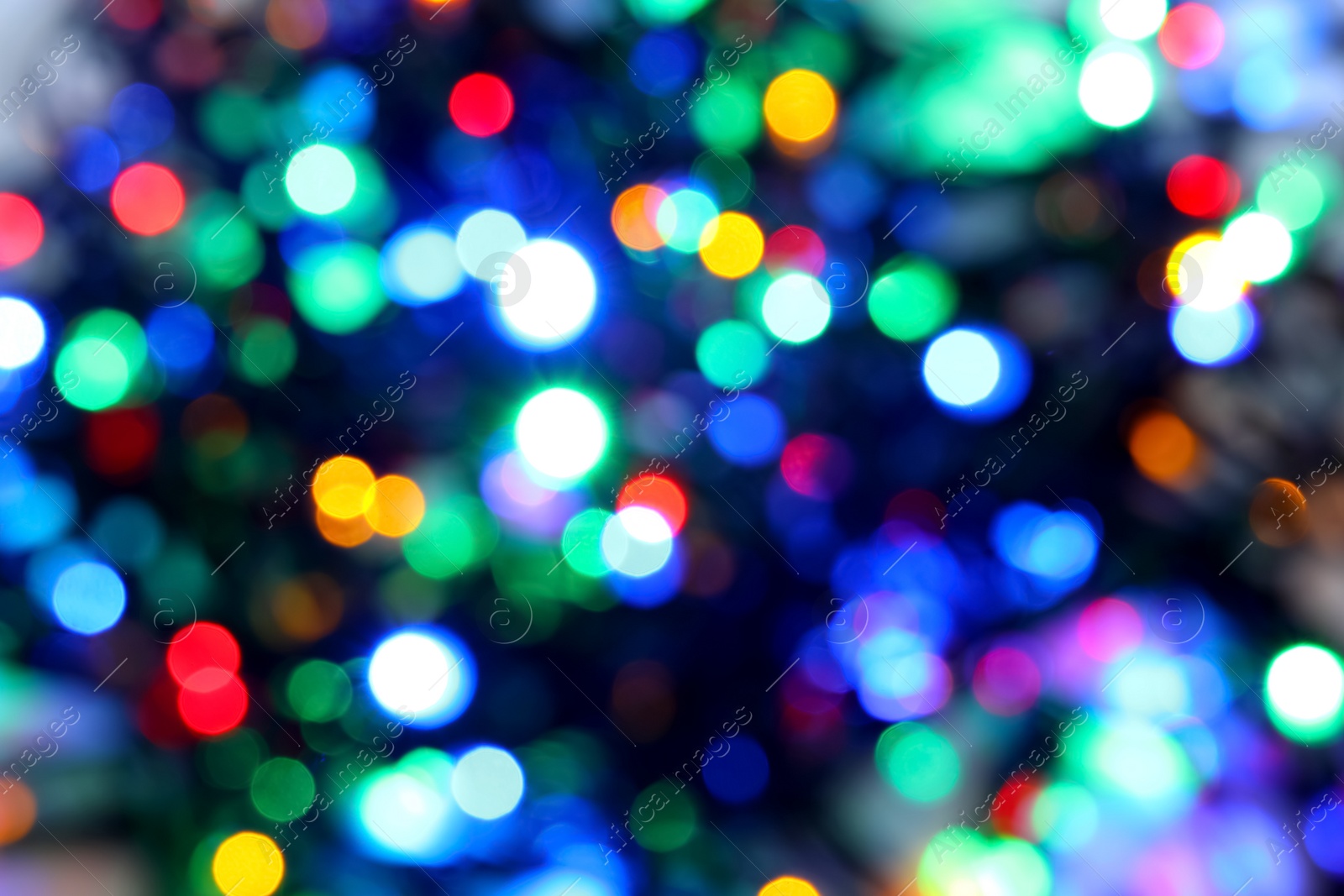 Photo of Blurred view of beautiful Christmas lights. Festive background