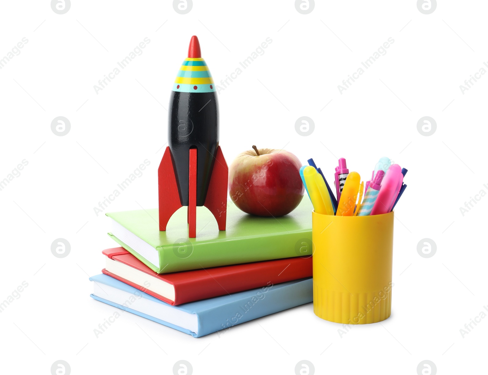 Photo of Bright toy rocket and school supplies on white background