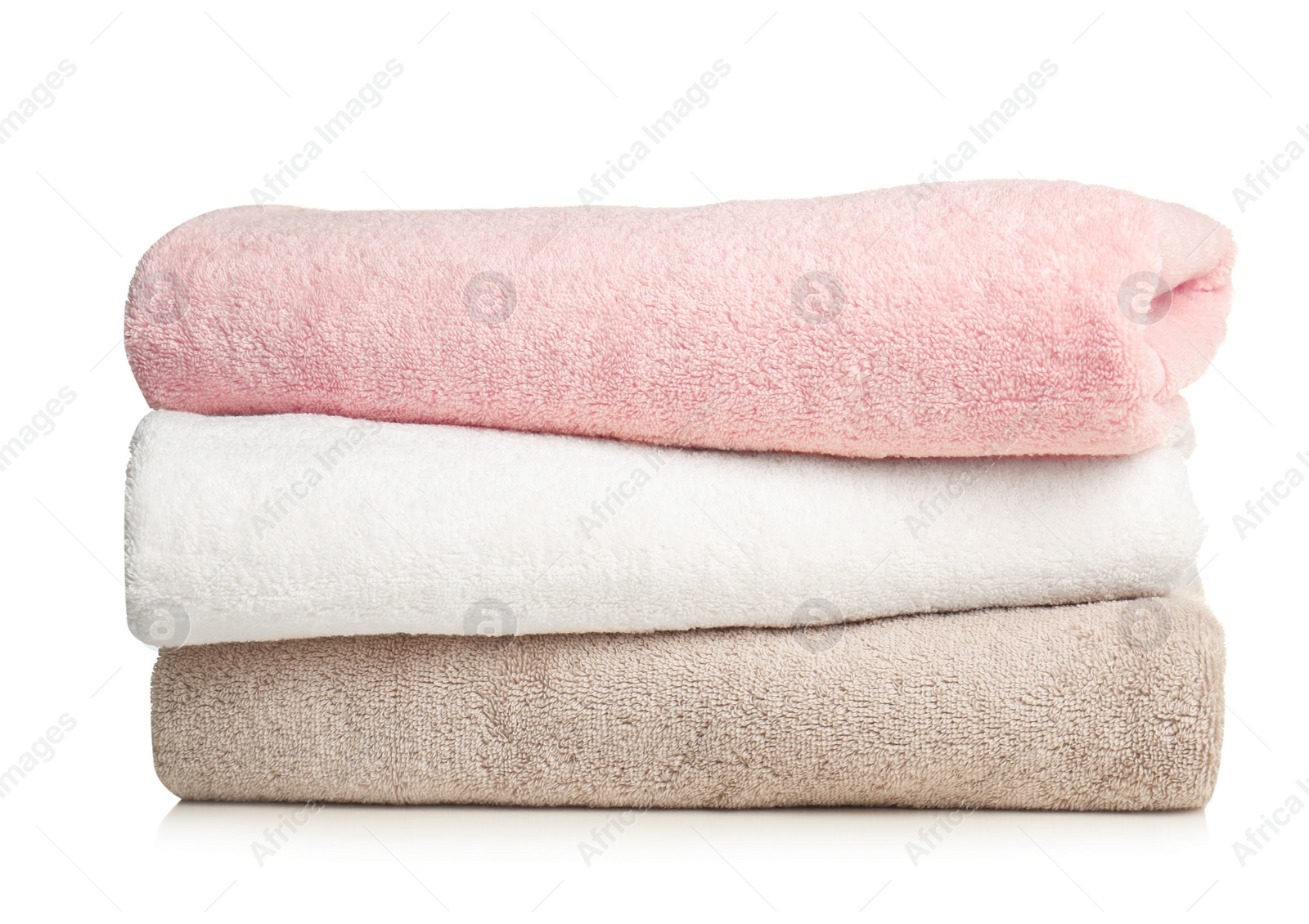 Photo of Folded soft terry towels on white background