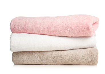 Folded soft terry towels on white background