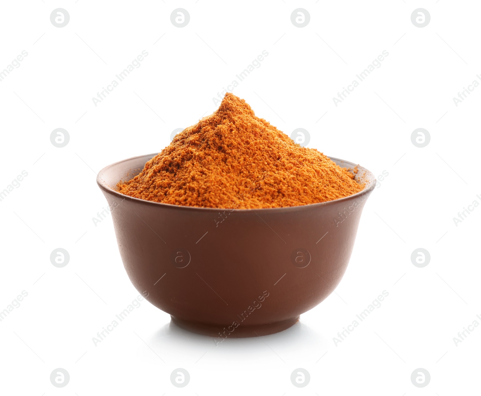 Photo of Bowl with red pepper powder on white background