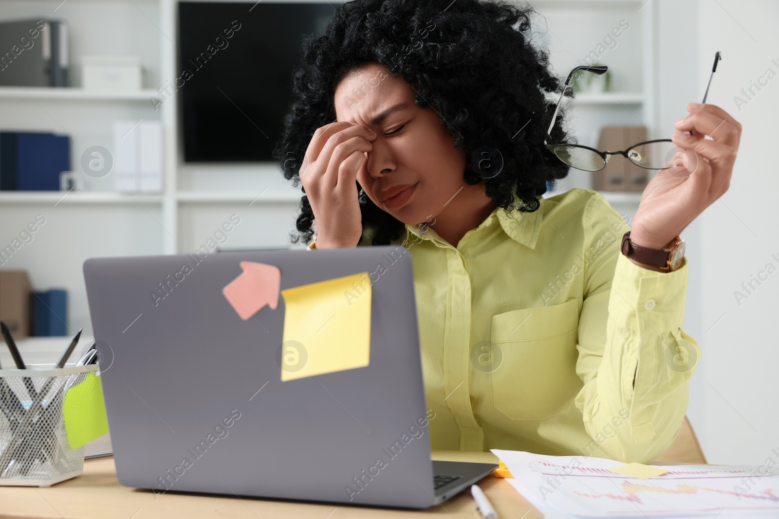 Photo of Deadline concept. Stressed woman near laptop at table in office