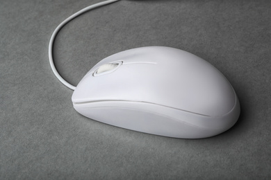 Photo of Modern wired computer mouse on grey background