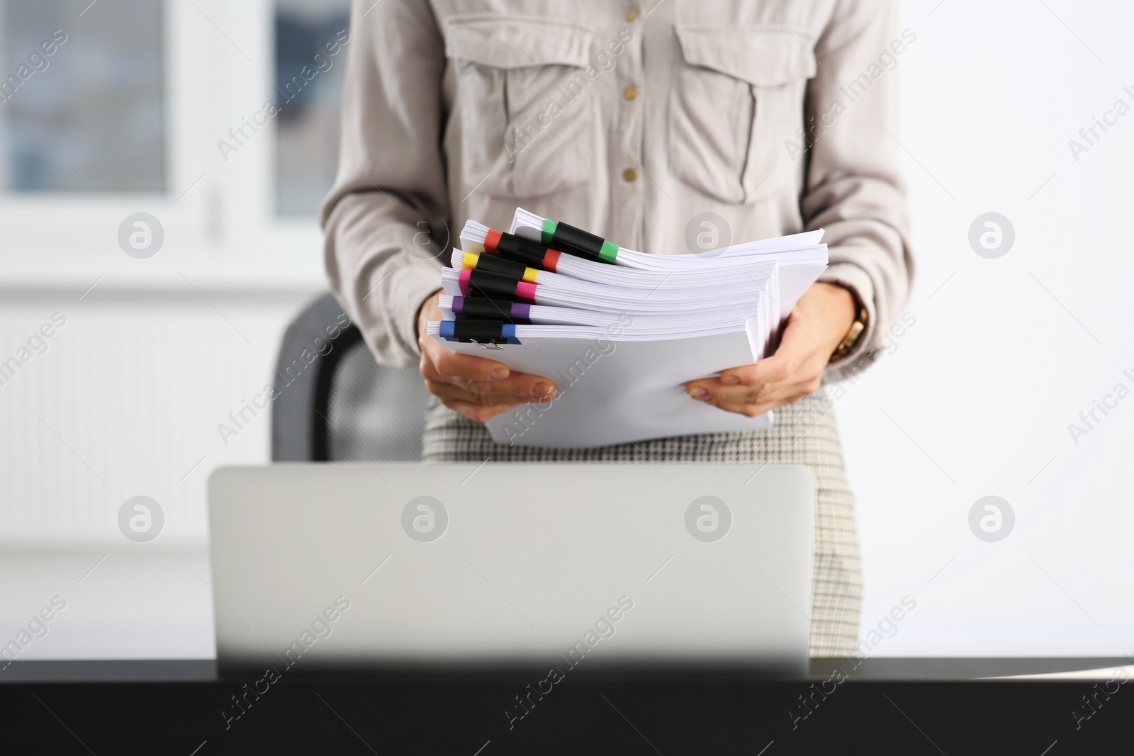 Photo of Businesswoman with documents in office, closeup view