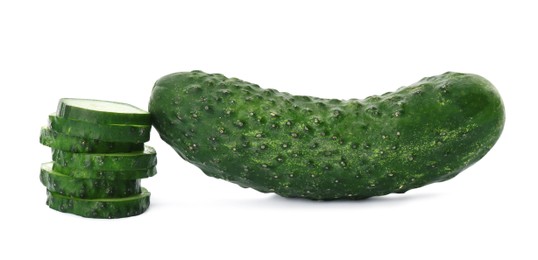 Photo of Whole and cut cucumbers on white background