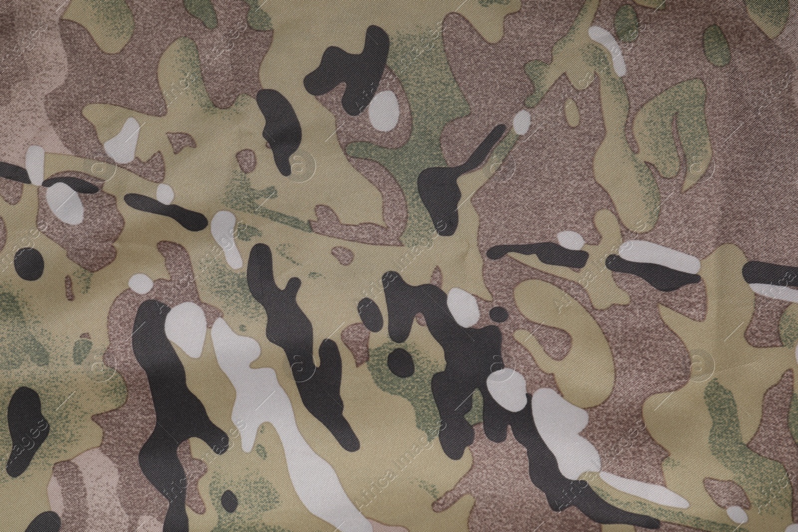 Photo of Texture of camouflage fabric as background, top view