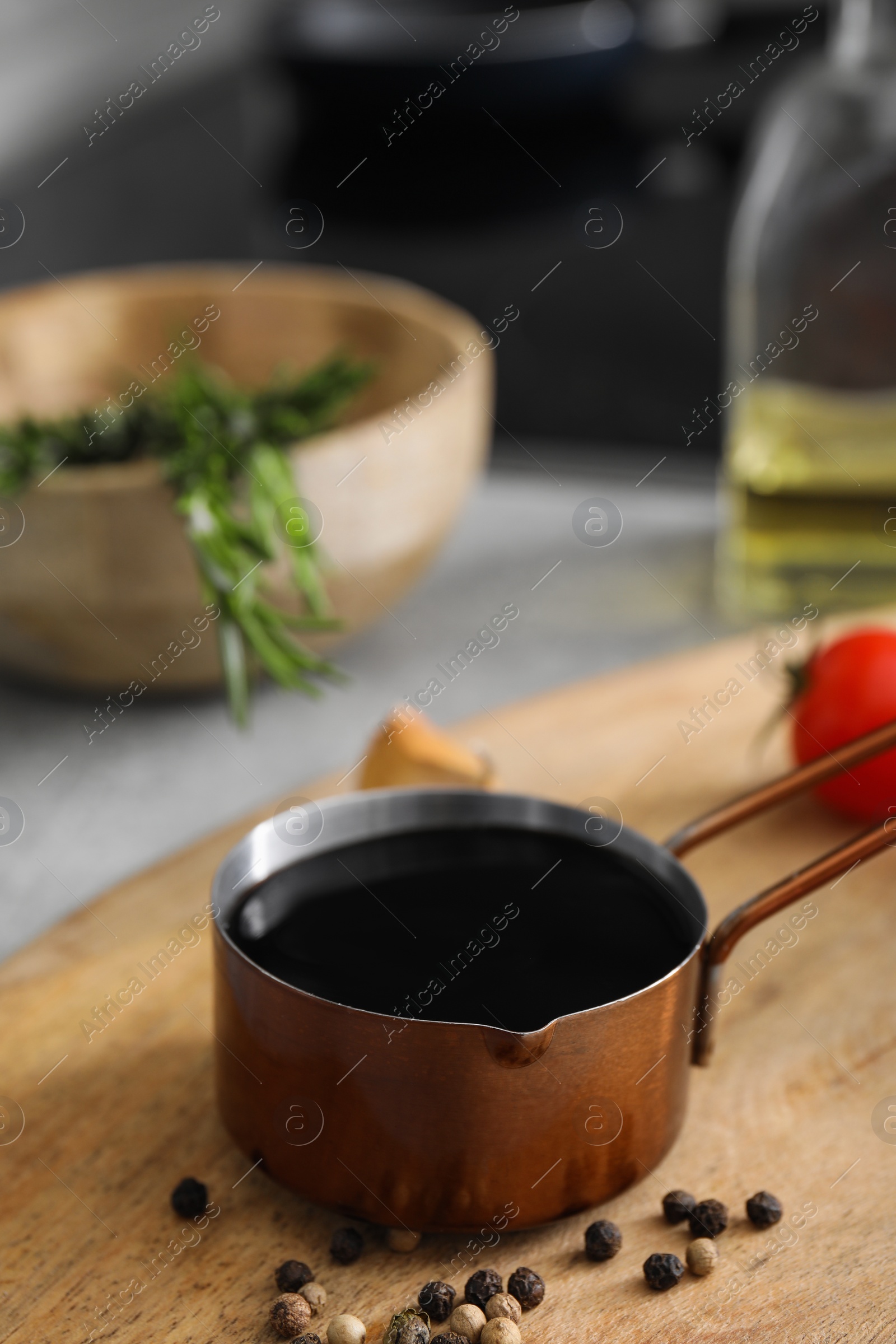 Photo of Organic balsamic vinegar and cooking ingredients on table