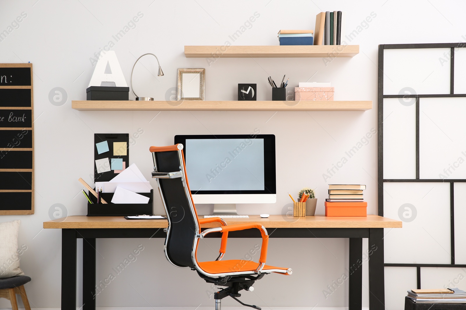 Photo of Modern computer on table in office interior. Stylish workplace