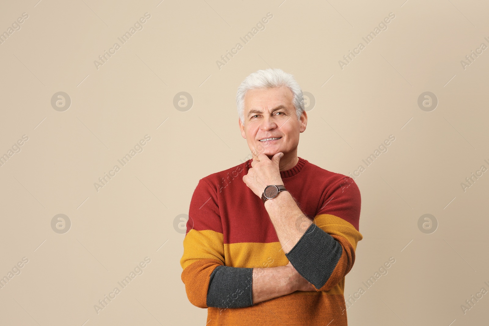 Photo of Portrait of handsome mature man on color background. Space for text