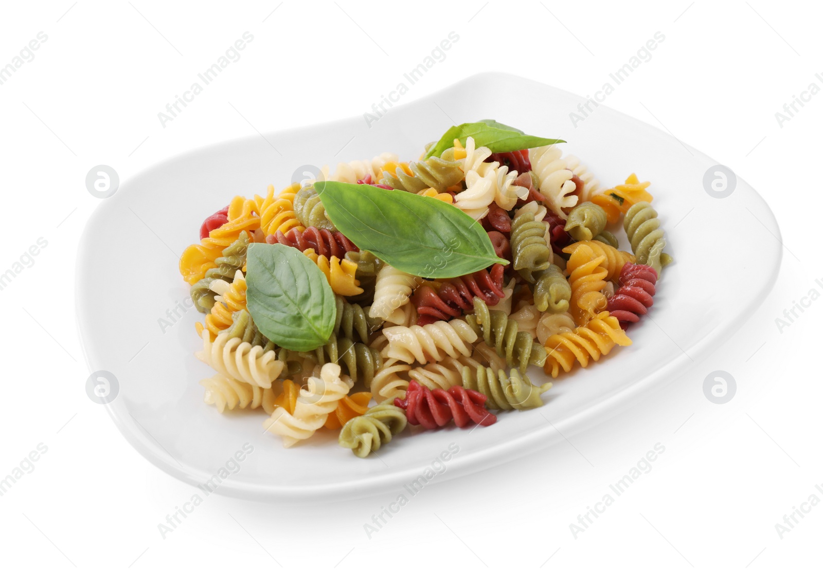 Photo of Delicious vegetable spiraline pasta with basil isolated on white