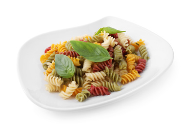 Photo of Delicious vegetable spiraline pasta with basil isolated on white