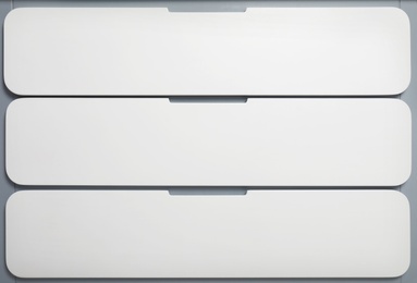 Photo of Modern white chest of drawers as background