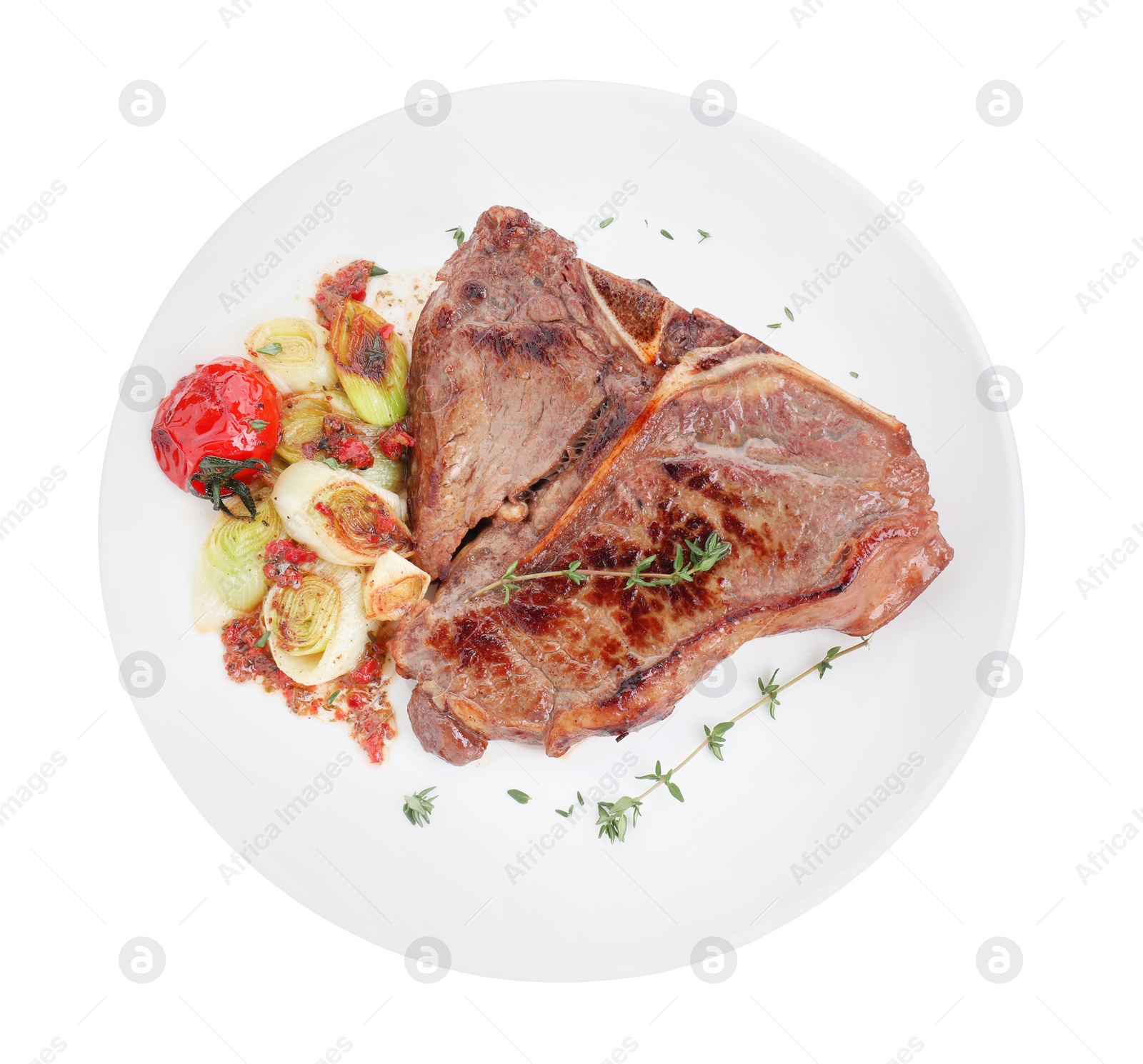 Photo of Delicious fried beef meat and vegetables isolated on white, top view