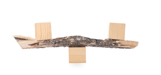 Photo of Tree branch with wooden cubes on white background. Harmony and balance concept