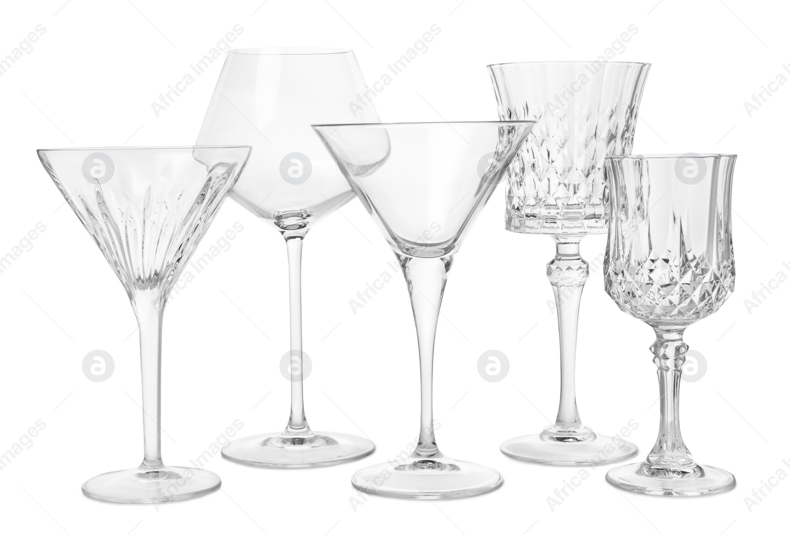 Photo of Different elegant empty glasses isolated on white