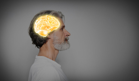 Thinking concept, space for text. Mature man and illustrated brain on grey background