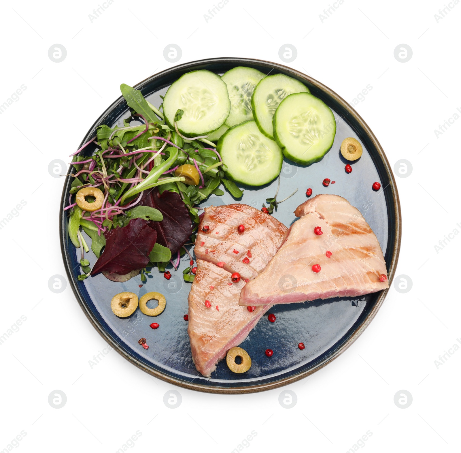 Photo of Pieces of delicious tuna steak with olives, salad and cucumbers on white background, top view