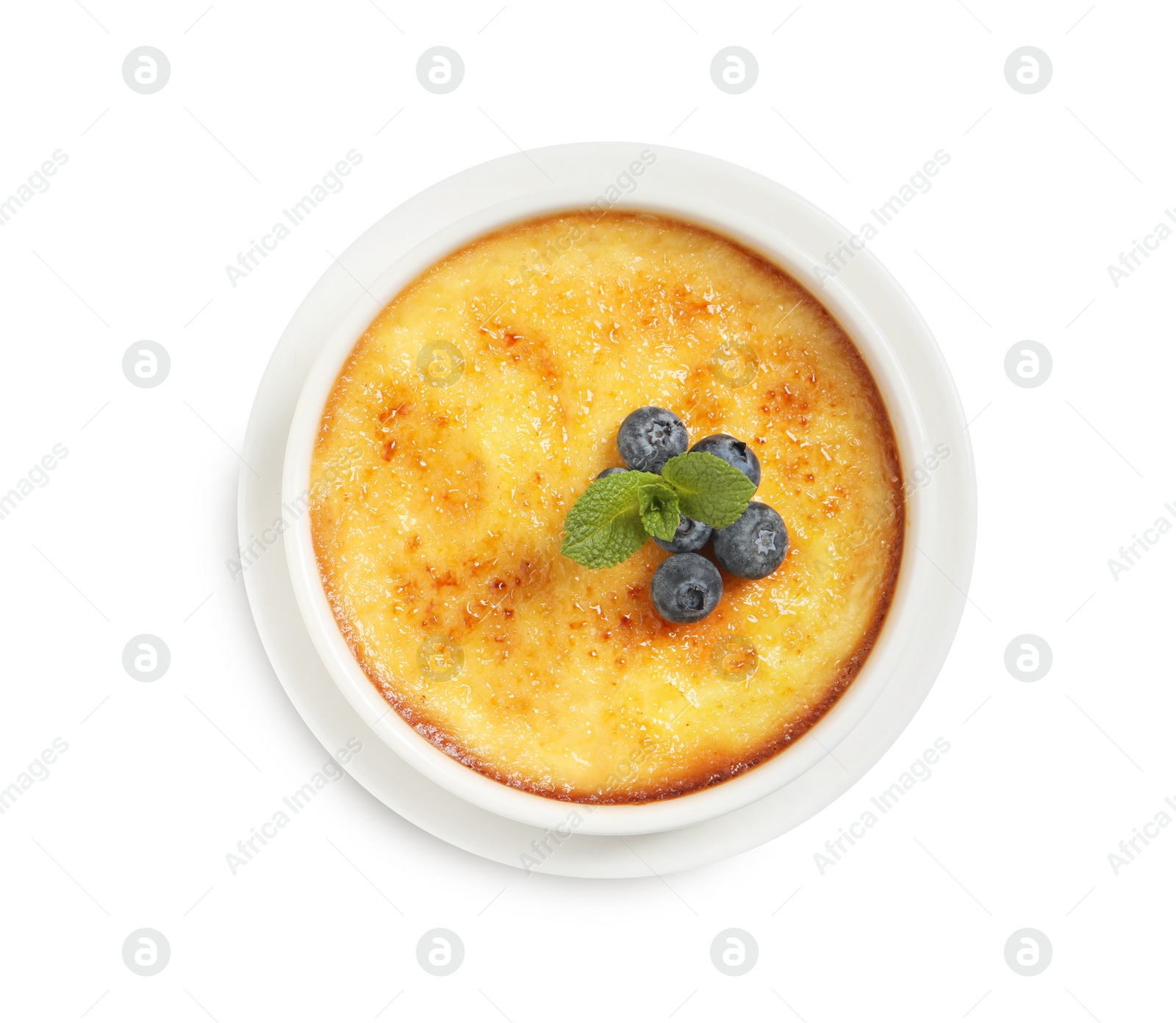 Photo of Delicious creme brulee with fresh blueberries isolated on white, top view