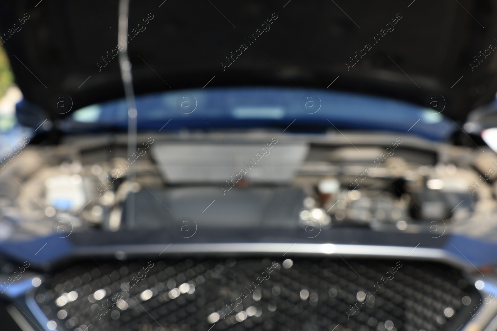 Photo of Blurred view of car engine in modern auto