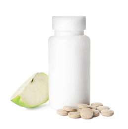 Photo of Bottle with vitamin pills and apple on white background