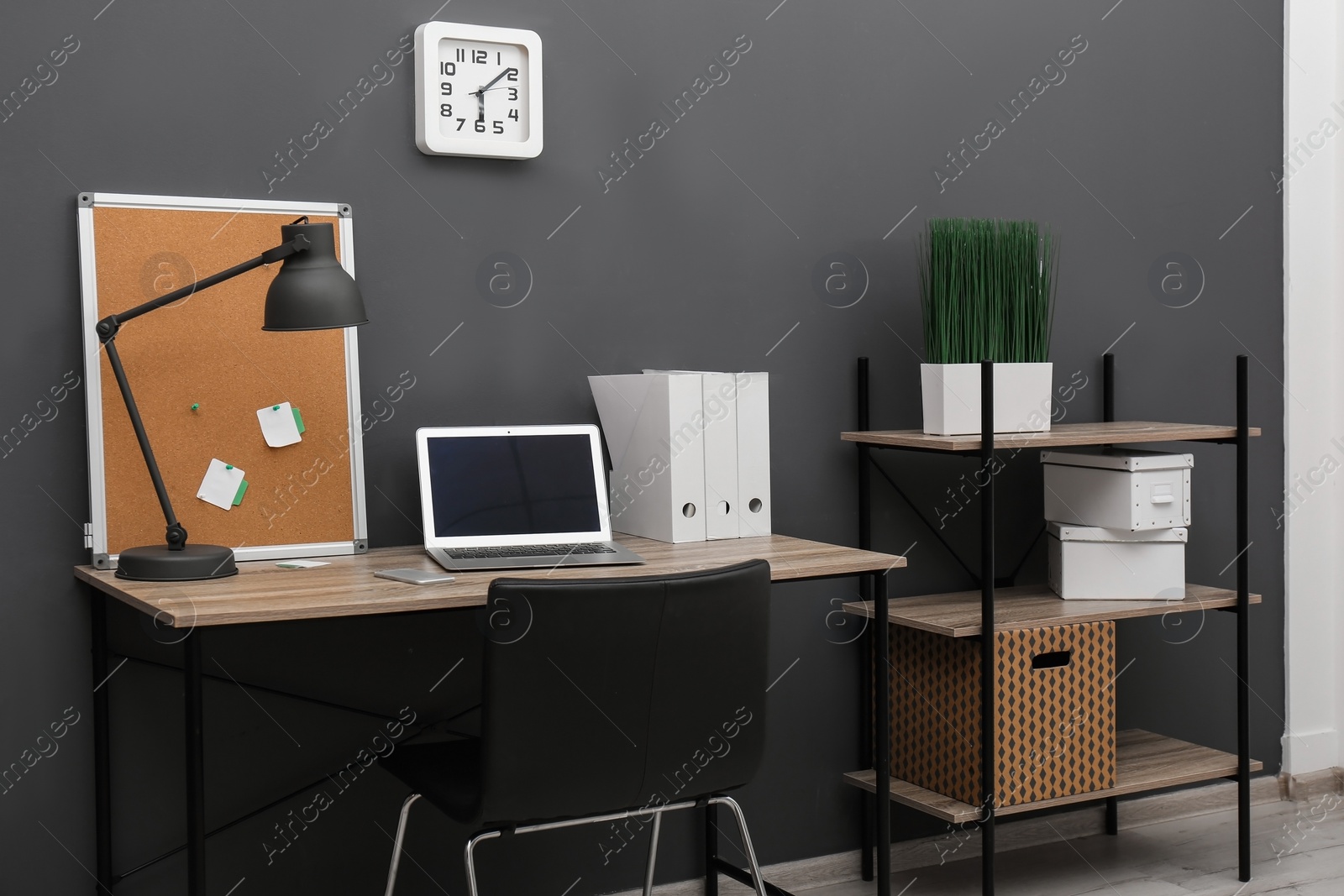 Photo of Interior of stylish workplace with modern laptop in home office