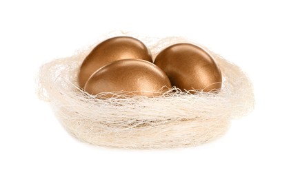 Photo of Many golden eggs in nest on white background