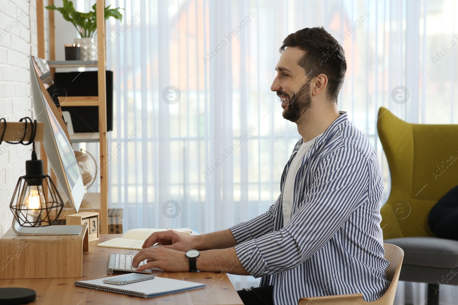 Photo of Online test. Man studying with computer at home