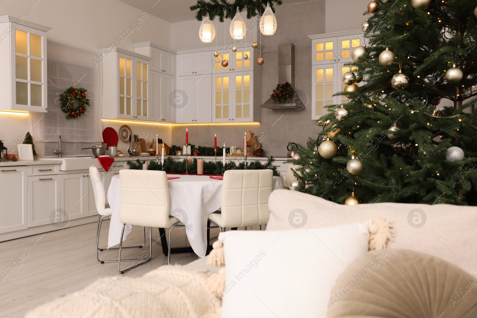 Photo of Cozy spacious kitchen decorated for Christmas. Interior design