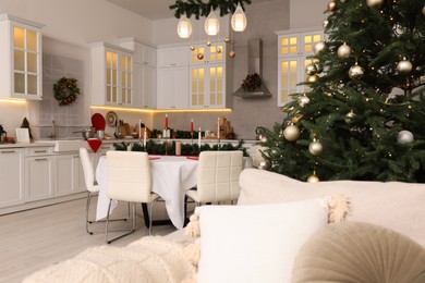 Cozy spacious kitchen decorated for Christmas. Interior design