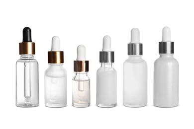 Serums in different bottles isolated on white, collection