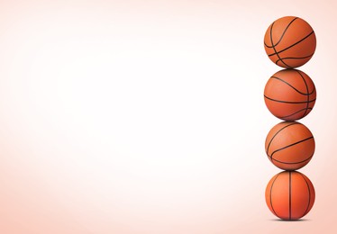 Image of Stack of basketball balls on light coral background. Space for text