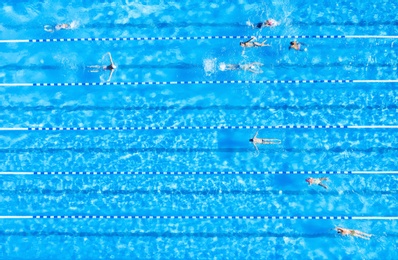 Image of People training in swimming pool, top view