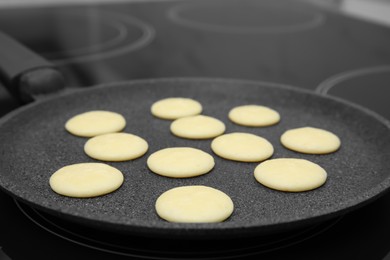 Frying tasty cereal pancakes on modern stove