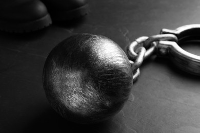 Photo of Prisoner ball with chain on black table