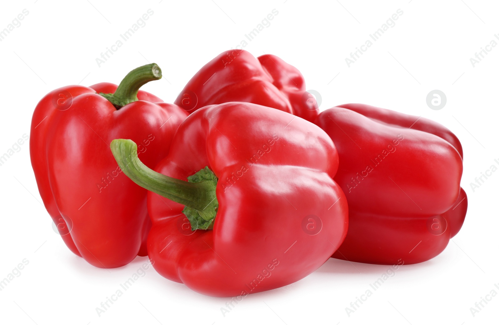 Photo of Ripe red bell peppers isolated on white