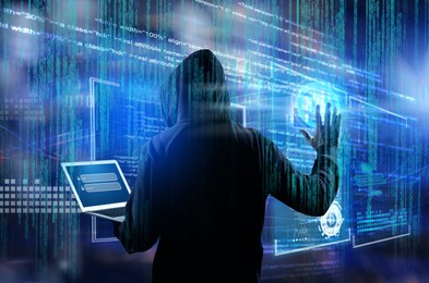 Image of Man in hood with laptop and digital code on dark background. Cyber attack concept