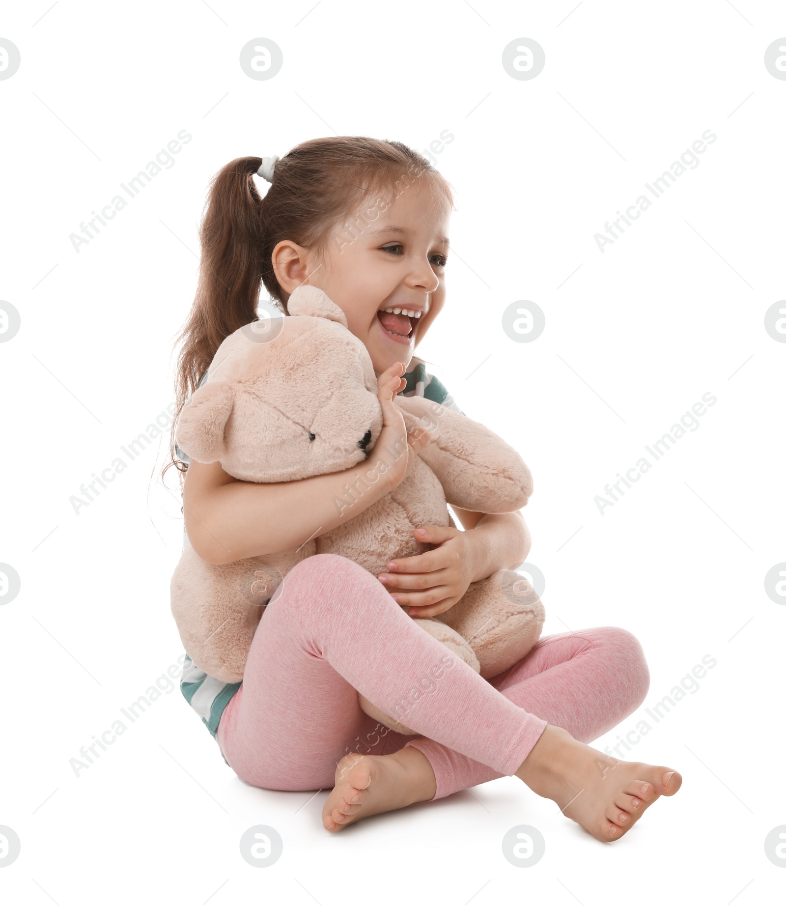 Photo of Portrait of cute little girl with teddy bear on white background