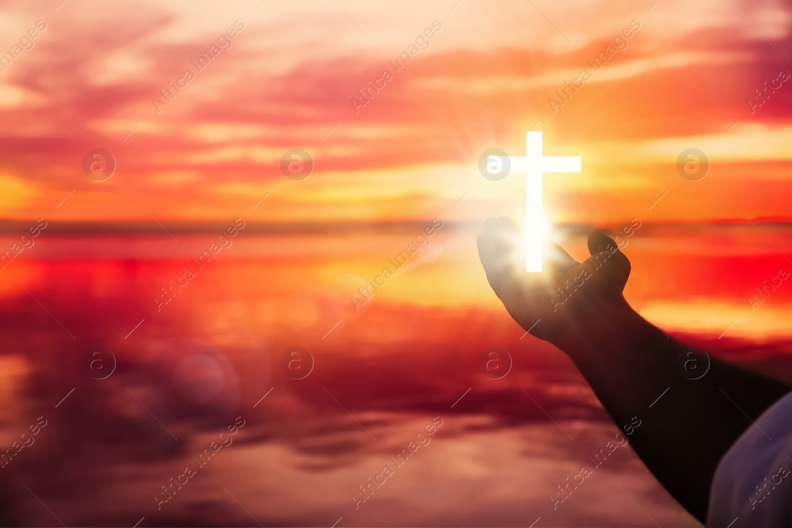 Image of Man and cross silhouette outdoors, closeup view with space for text. Belief in Jesus Christ 