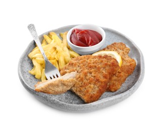 Photo of Plate of tasty schnitzels with french fries, ketchup and lemon isolated on white