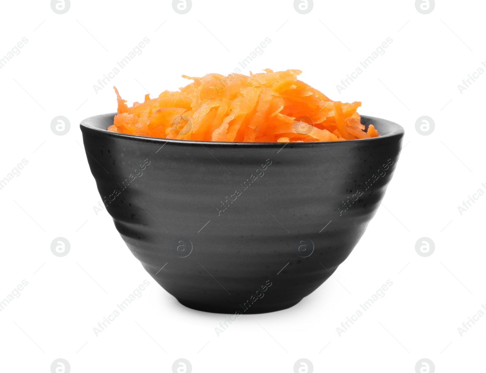 Photo of Fresh grated carrot in bowl isolated on white