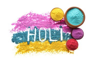 Colorful powders with word Holi on white background, top view
