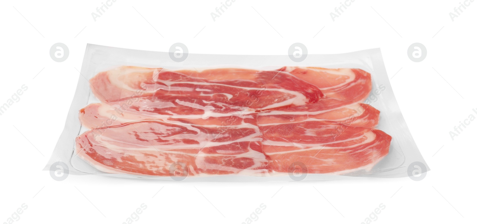 Photo of Pack of delicious sliced jamon isolated on white