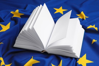 Photo of Open blank book on flag of European Union