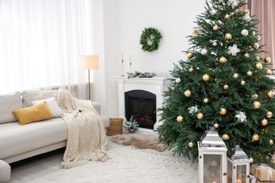 Photo of Christmas tree in furnished living room. Festive interior design