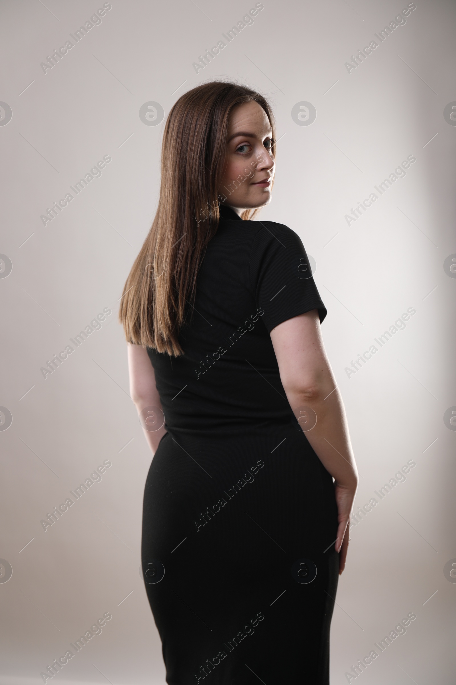 Photo of Portrait of beautiful woman on gray background