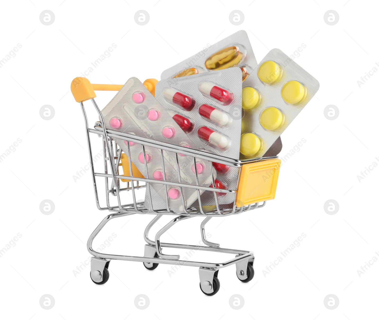 Photo of Blisters with different pills in mini shopping cart on white background