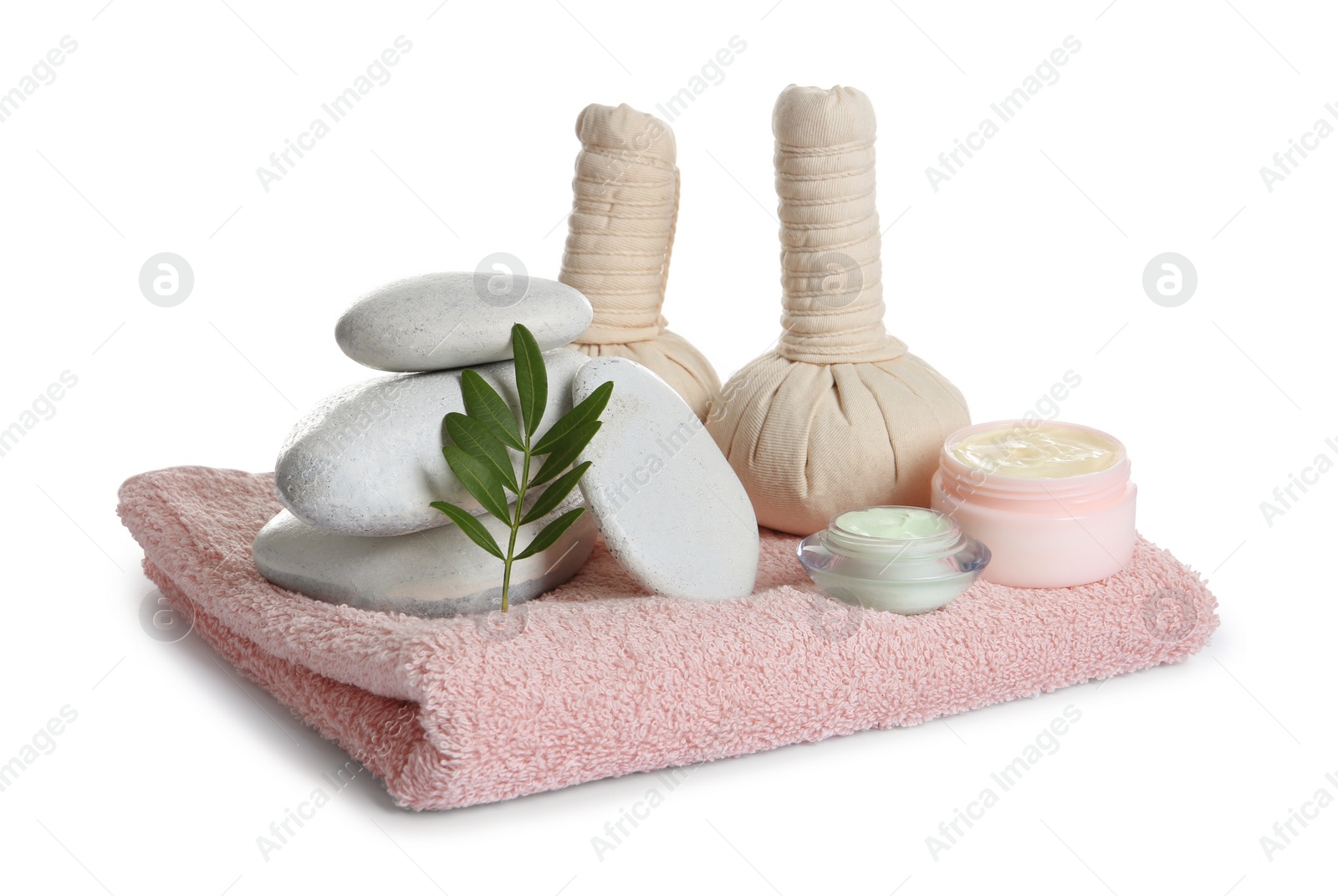 Photo of Composition with spa stones and towel on white background