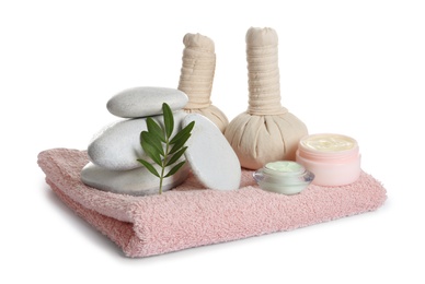 Composition with spa stones and towel on white background