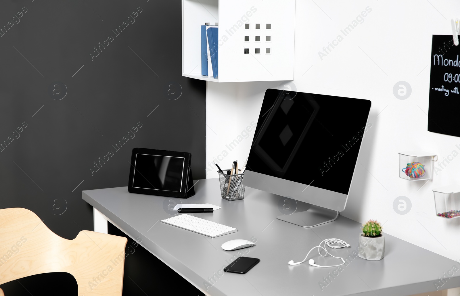 Photo of Modern interior of workplace with computer and accessories