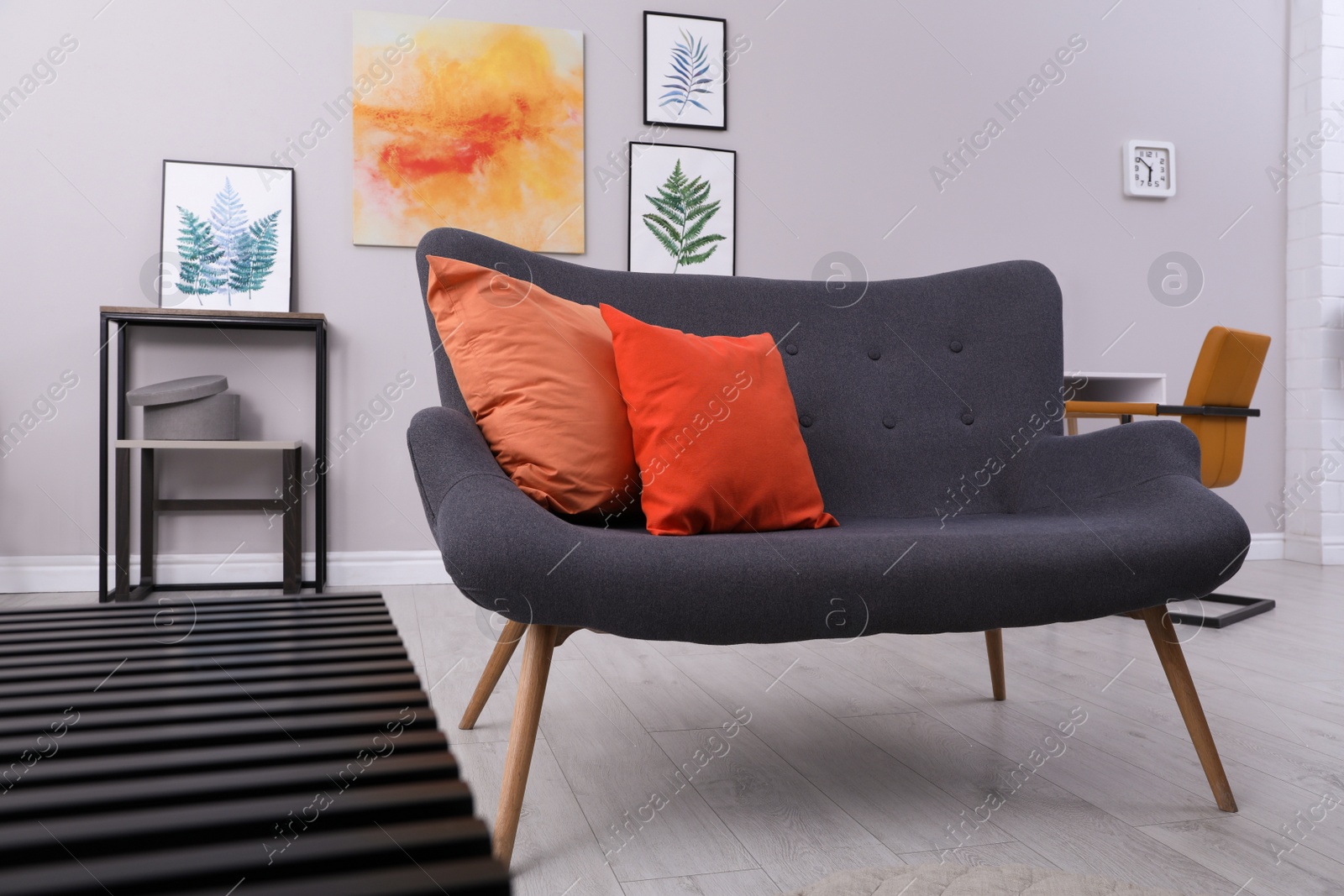Photo of Stylish living room interior with comfortable grey couch